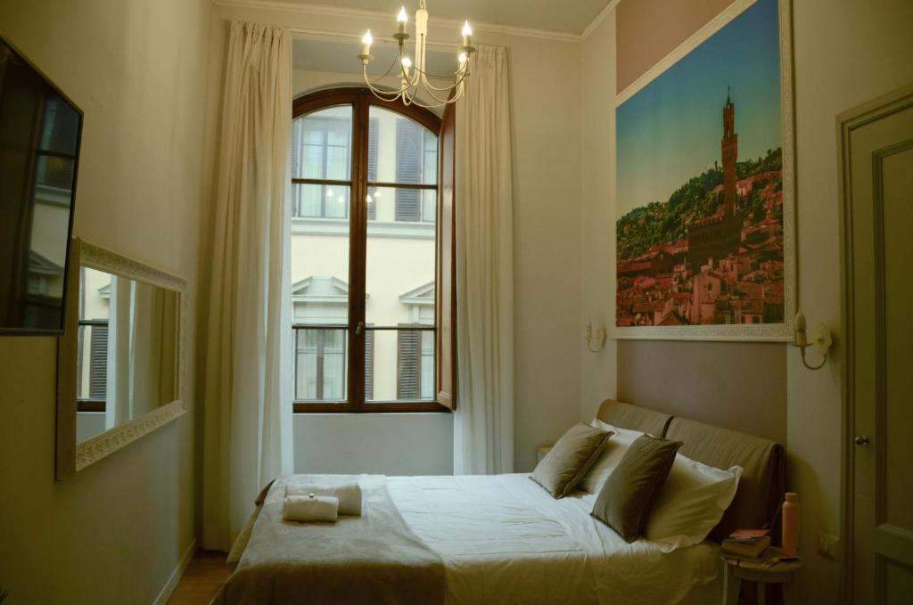 Posteľ alebo postele v izbe v ubytovaní B&B Dimora Sassetti 6