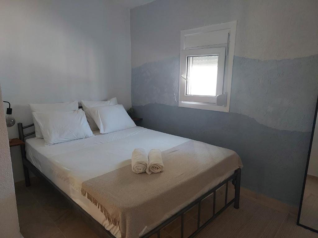 Postel nebo postele na pokoji v ubytování Roni's Place