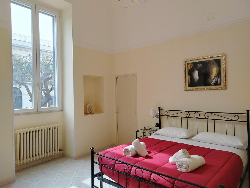 Posteľ alebo postele v izbe v ubytovaní Palazzo Castellano