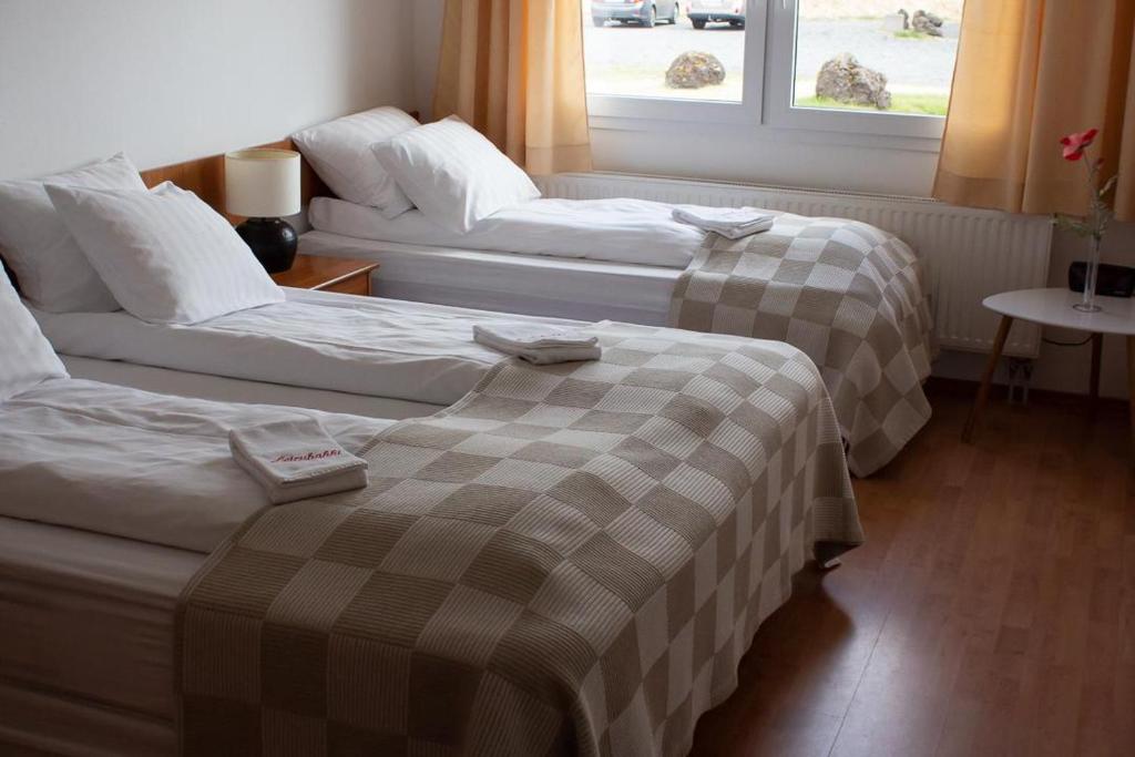Postel nebo postele na pokoji v ubytování Hotel Leirubakki