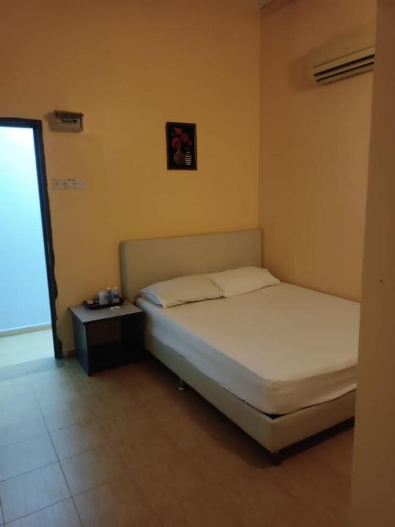 Postel nebo postele na pokoji v ubytování Wonderful Motel