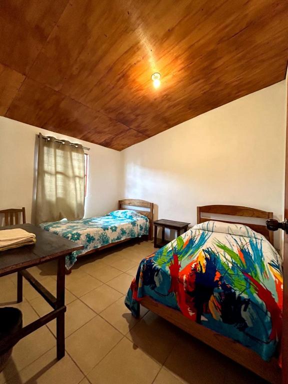 Postel nebo postele na pokoji v ubytování Rancho Colibrí