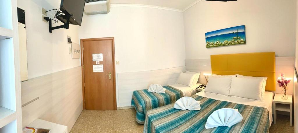 Postel nebo postele na pokoji v ubytování Hotel Crystal anche con spiaggia inclusa ALL INCLUSIVE