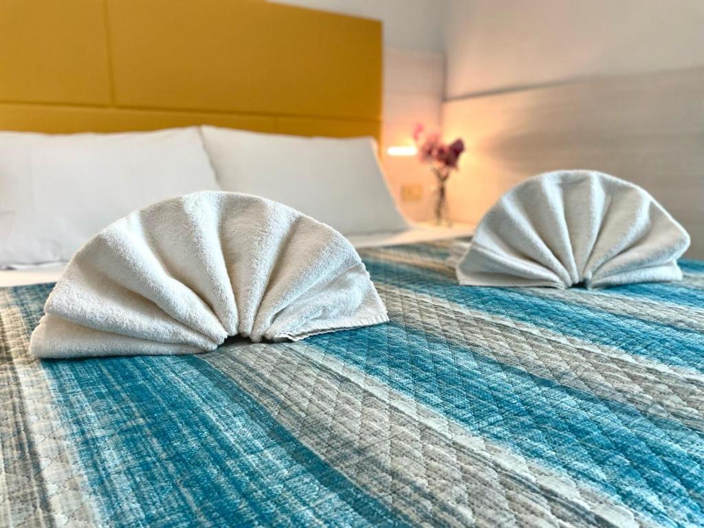 Postel nebo postele na pokoji v ubytování Hotel Crystal anche con spiaggia inclusa ALL INCLUSIVE
