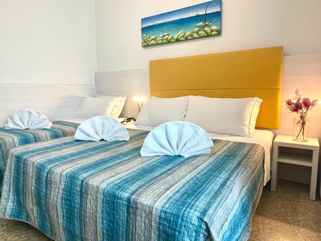 Postel nebo postele na pokoji v ubytování Hotel Crystal anche con spiaggia inclusa ALL INCLUSIVE