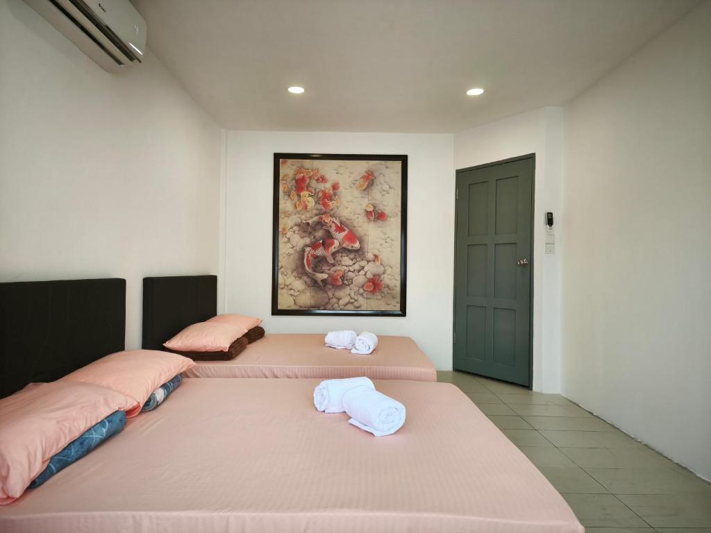 Giường trong phòng chung tại Miri Homie Homestay 2