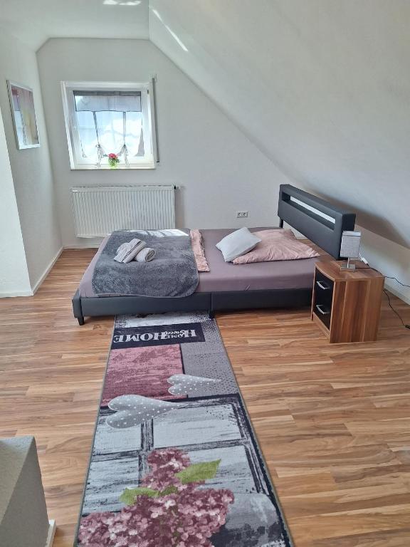 Postel nebo postele na pokoji v ubytování 5-Zimmer Ferienwohnung Welzheimer Wald