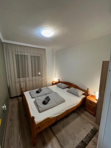 a bedroom with a large bed in a room at Haraplak in Hajdúszoboszló