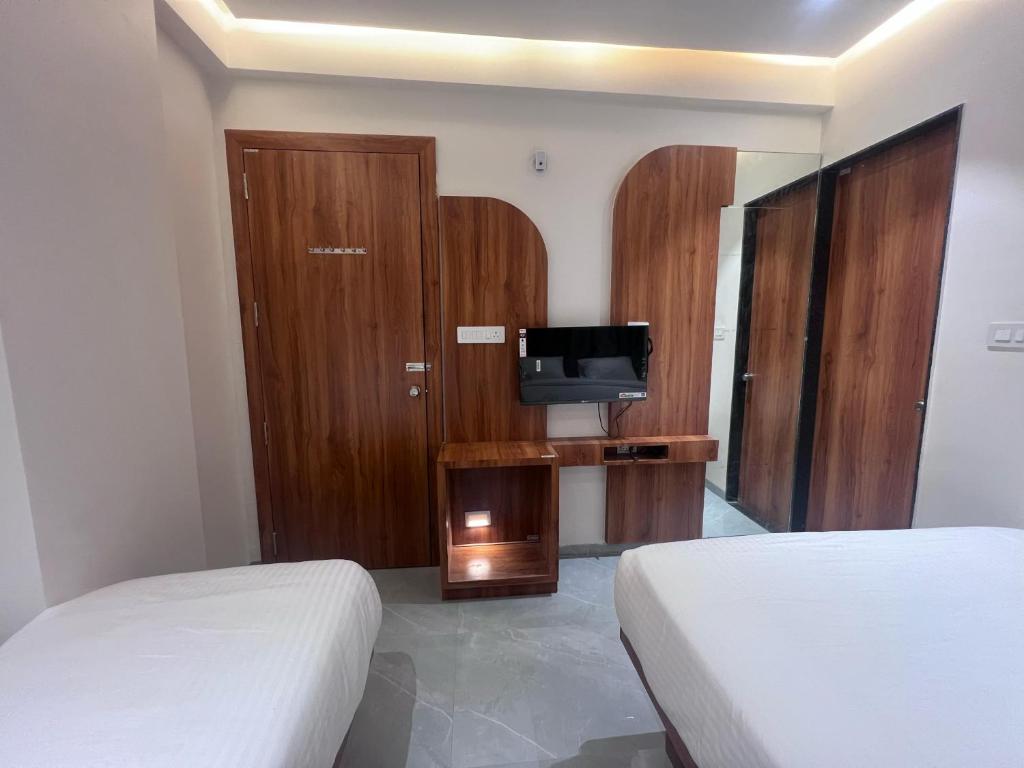 Postel nebo postele na pokoji v ubytování Hotel Rudraksh