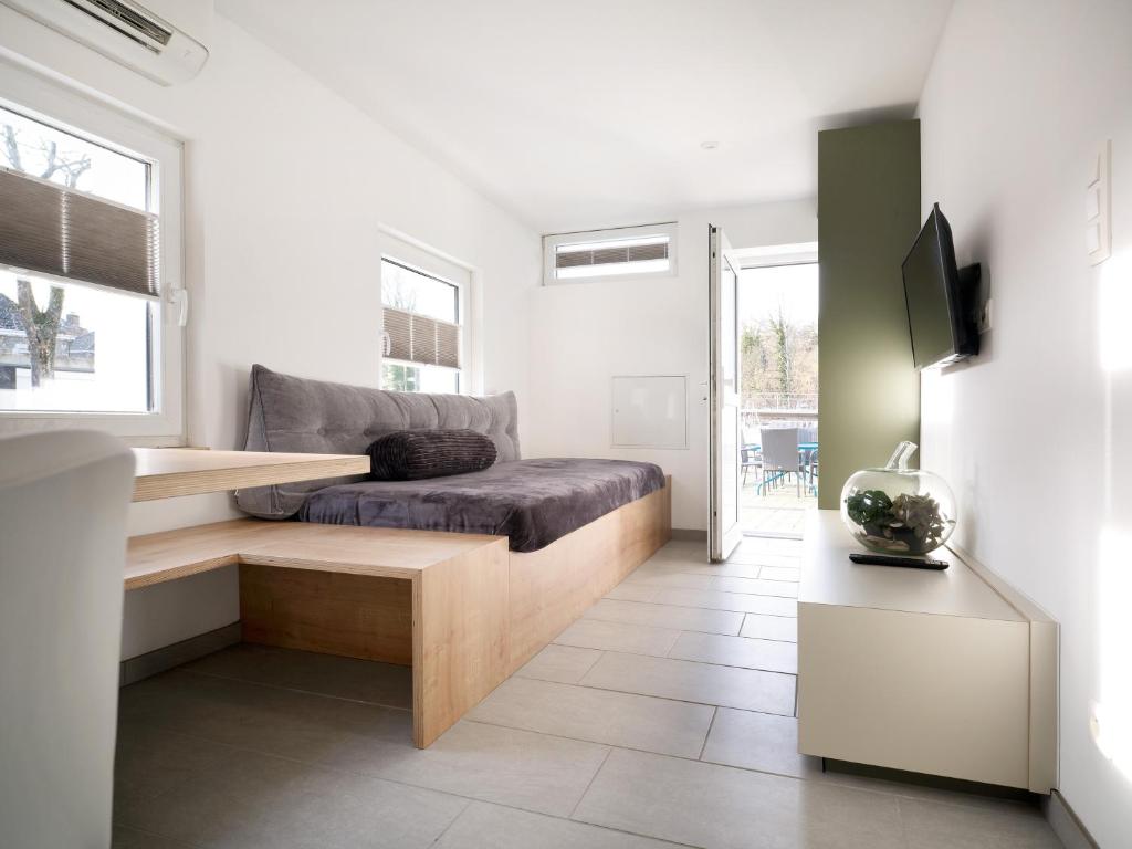 Postel nebo postele na pokoji v ubytování Aparthouse HAAS41 - Eupen