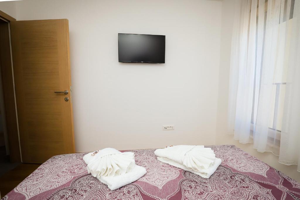 Postel nebo postele na pokoji v ubytování Apartman NN
