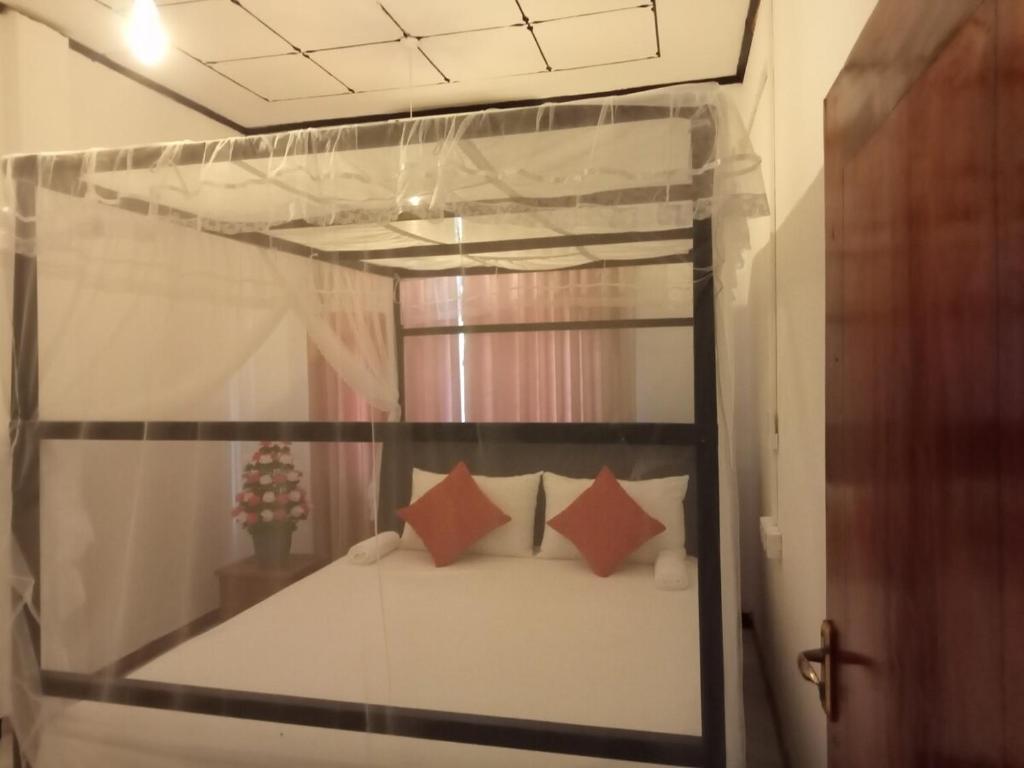 Postel nebo postele na pokoji v ubytování Vimukthi ocean bliss villa
