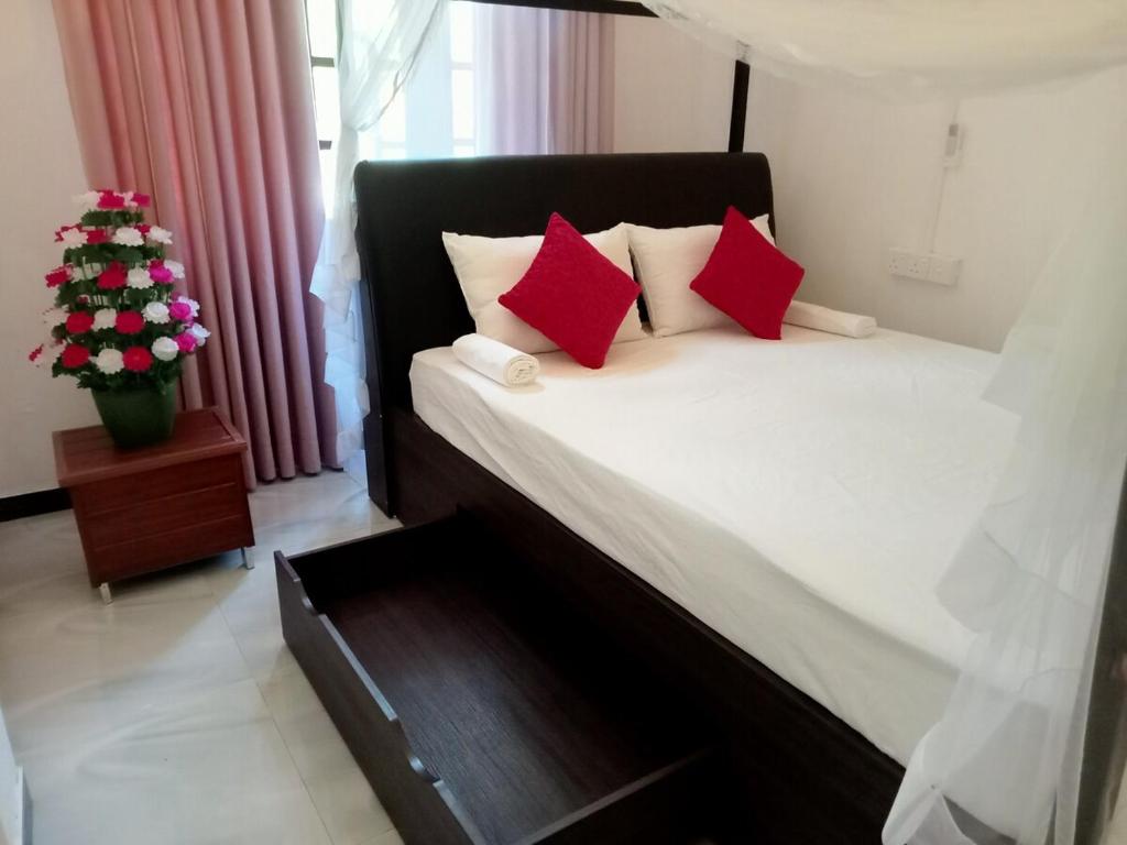 Postel nebo postele na pokoji v ubytování Vimukthi ocean bliss villa