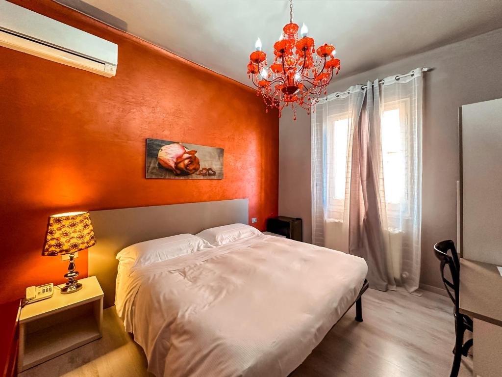 Postel nebo postele na pokoji v ubytování Hotel Alba