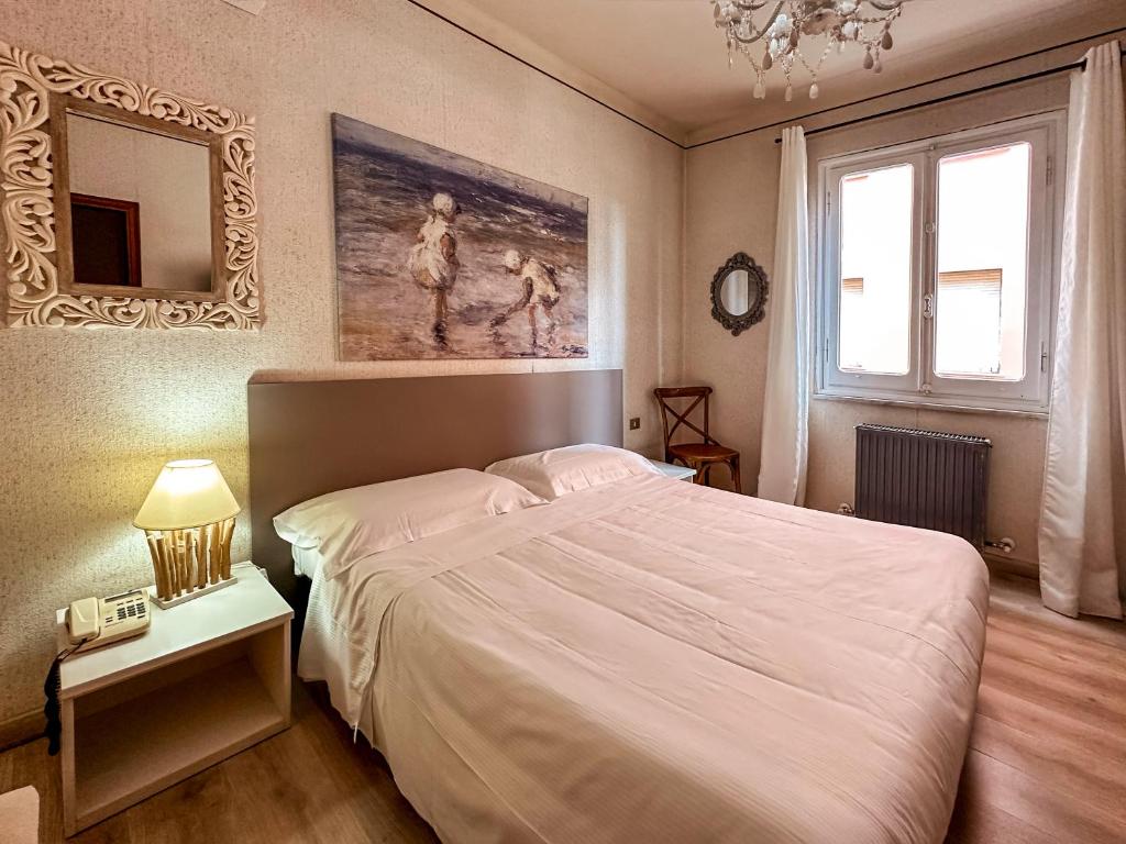 Postel nebo postele na pokoji v ubytování Hotel Alba