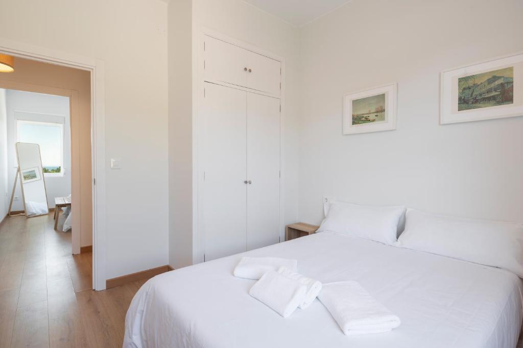 Łóżko lub łóżka w pokoju w obiekcie Perbes Beach Terrace R