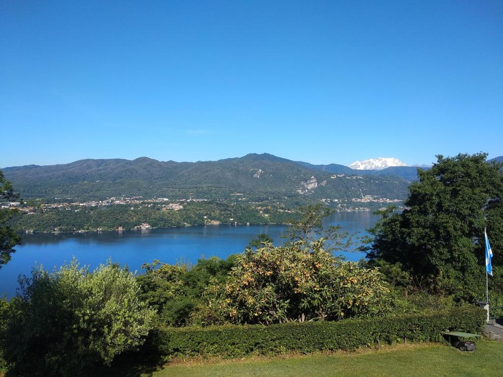 a view of a lake with mountains in the background at La Corte sul lago in Ameno