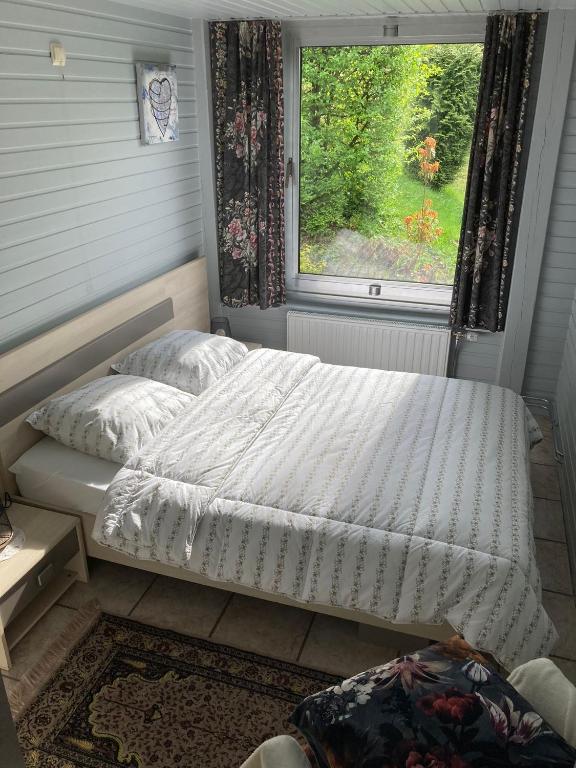 Postel nebo postele na pokoji v ubytování Le Vieux prés