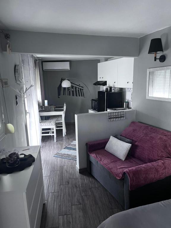 A seating area at Cozy studio apartment in the heart of Athens