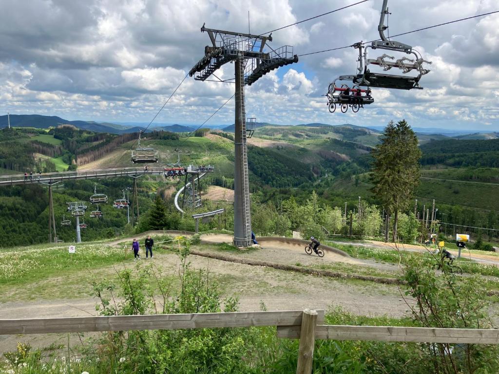 a gondola ride in the mountains with people at Haus am Skilift Postwiese in Winterberg