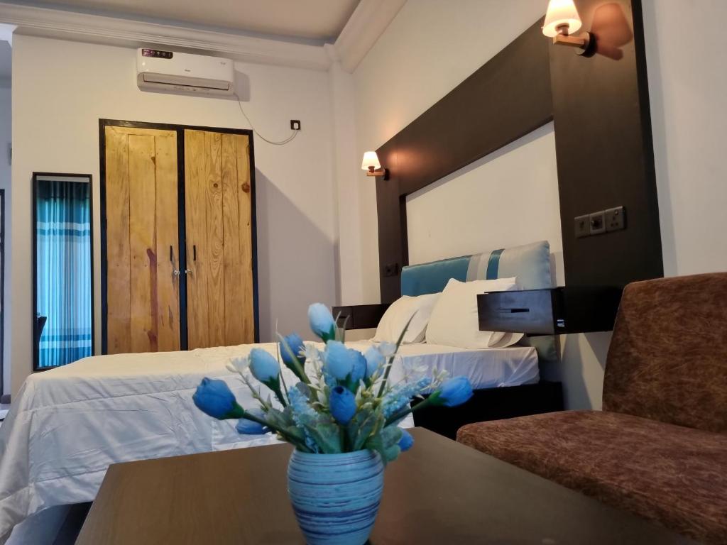 Postel nebo postele na pokoji v ubytování Aura Residence