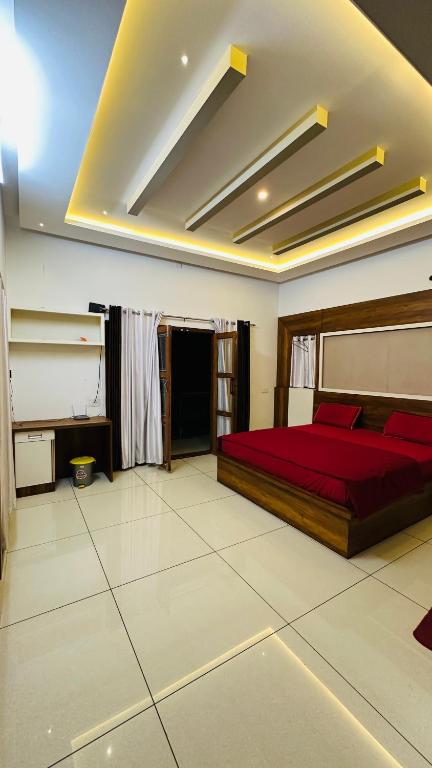 Postel nebo postele na pokoji v ubytování Hodophile Wayanad Homestay