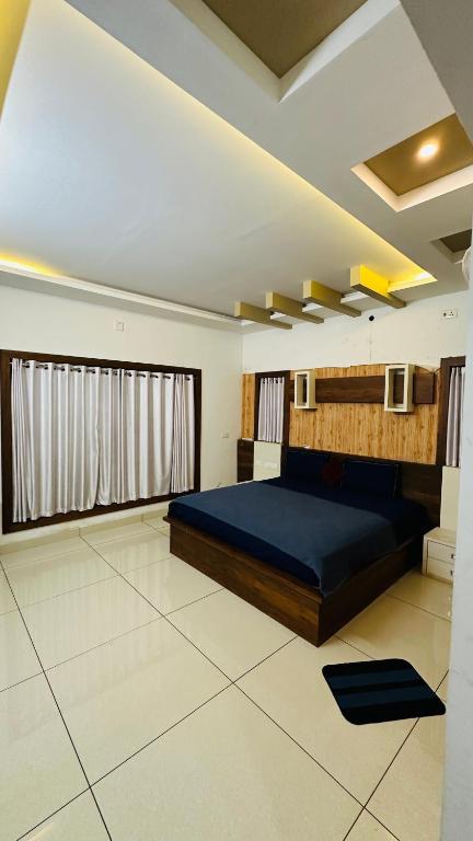 Postel nebo postele na pokoji v ubytování Hodophile Wayanad Homestay