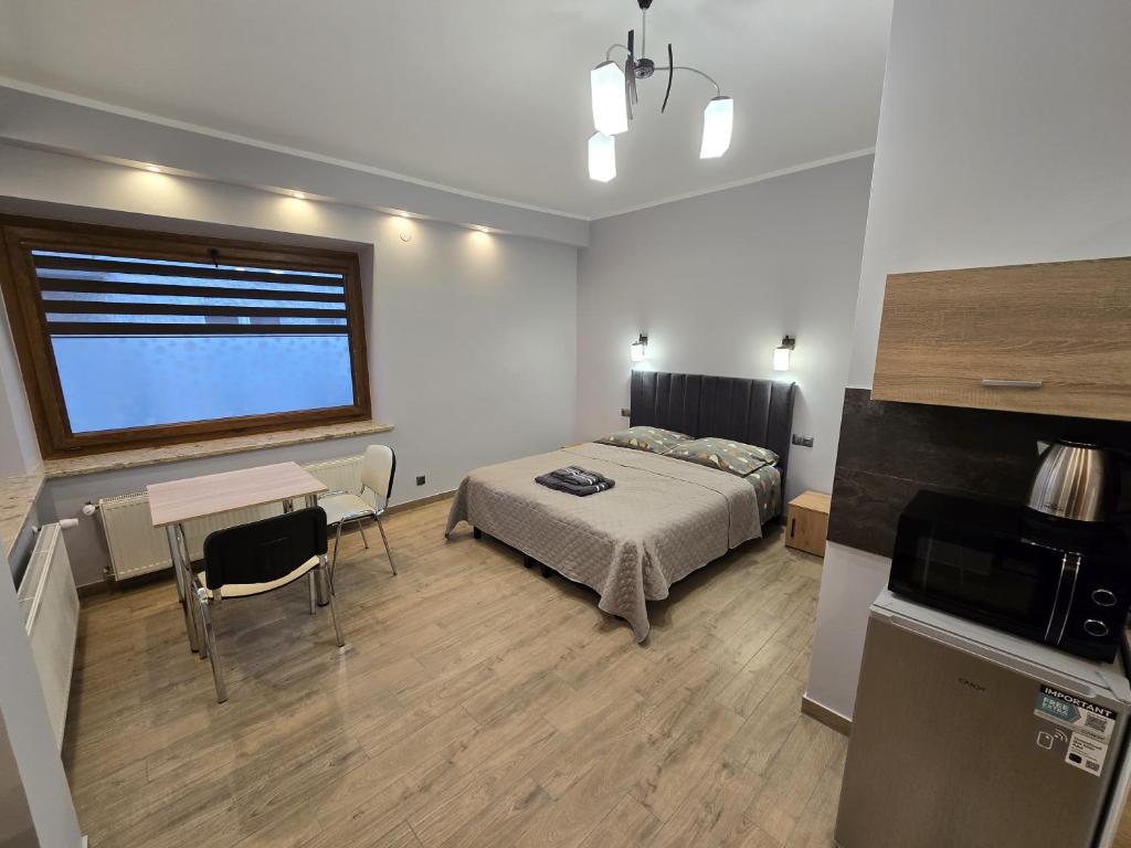 Posteľ alebo postele v izbe v ubytovaní Apartamenty Pokoje DreamZone
