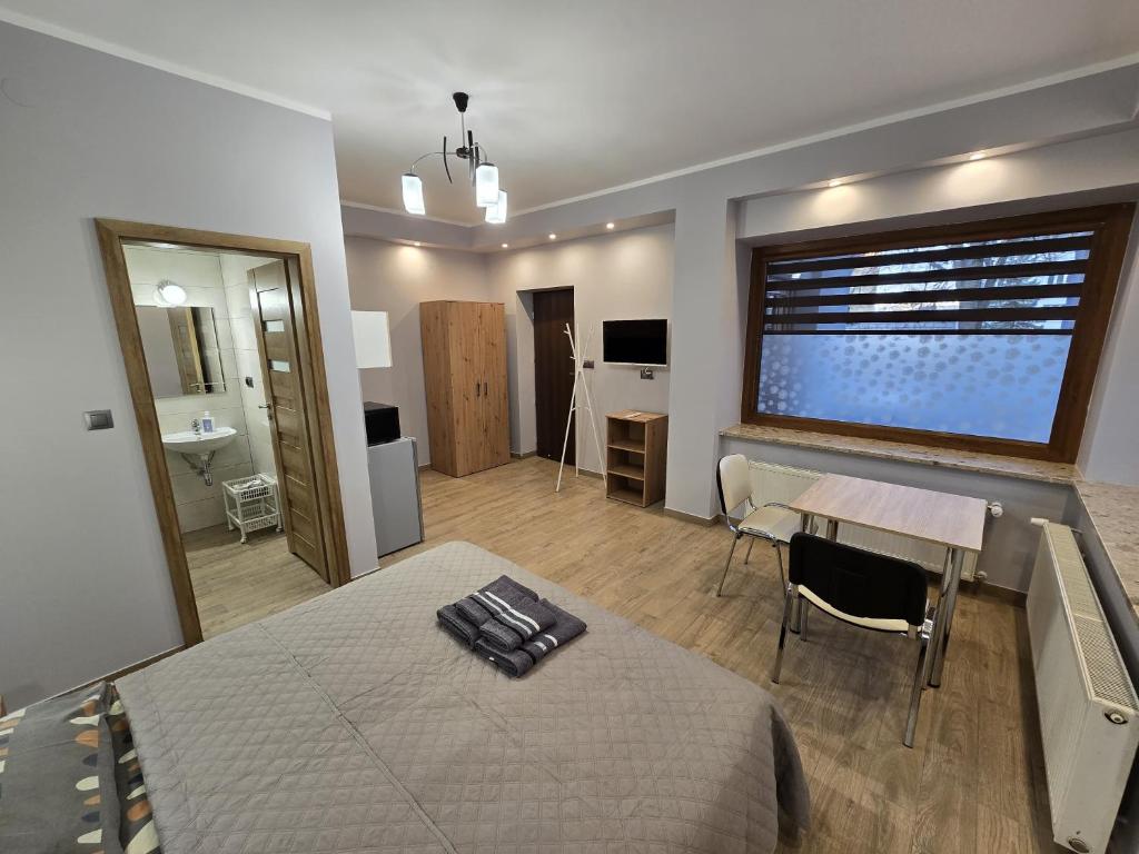 Posteľ alebo postele v izbe v ubytovaní Apartamenty Pokoje DreamZone