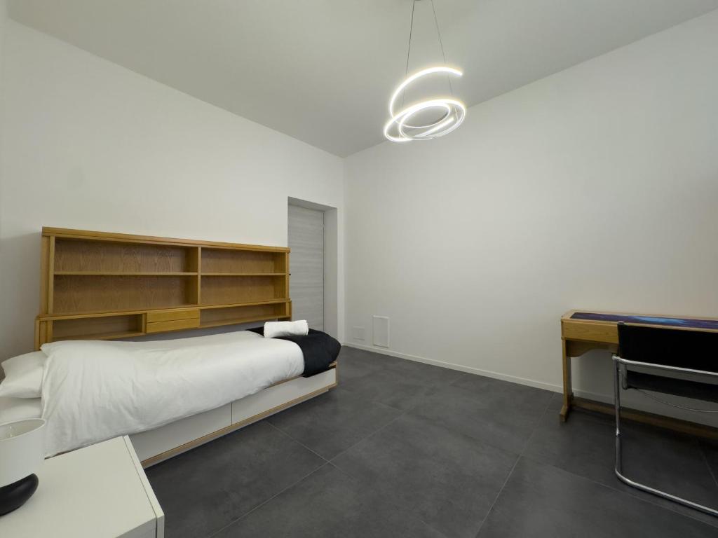 Postel nebo postele na pokoji v ubytování Appartamento G