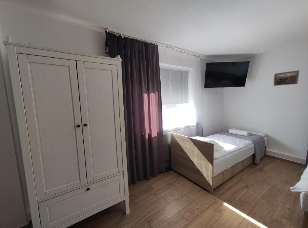 Postel nebo postele na pokoji v ubytování Pokoje Piaskowa 44