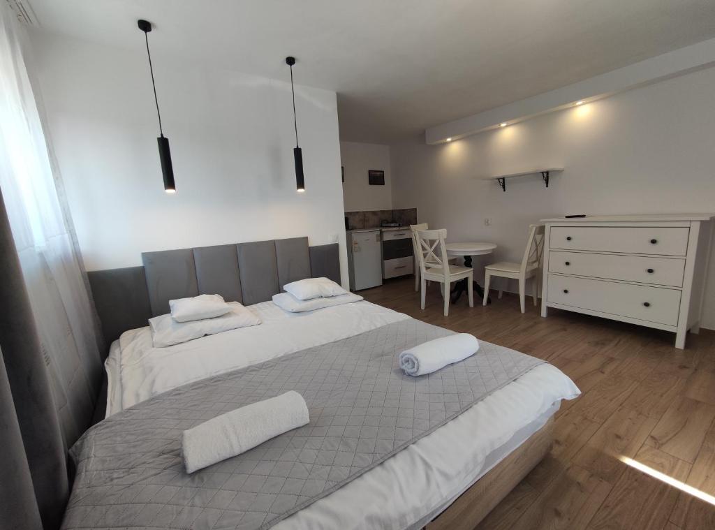 Postel nebo postele na pokoji v ubytování Pokoje Piaskowa 44