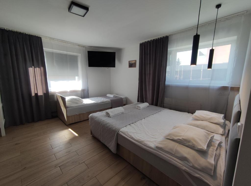 Postel nebo postele na pokoji v ubytování Pokoje Piaskowa 44