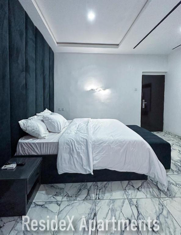 Postel nebo postele na pokoji v ubytování ResideX Apartment