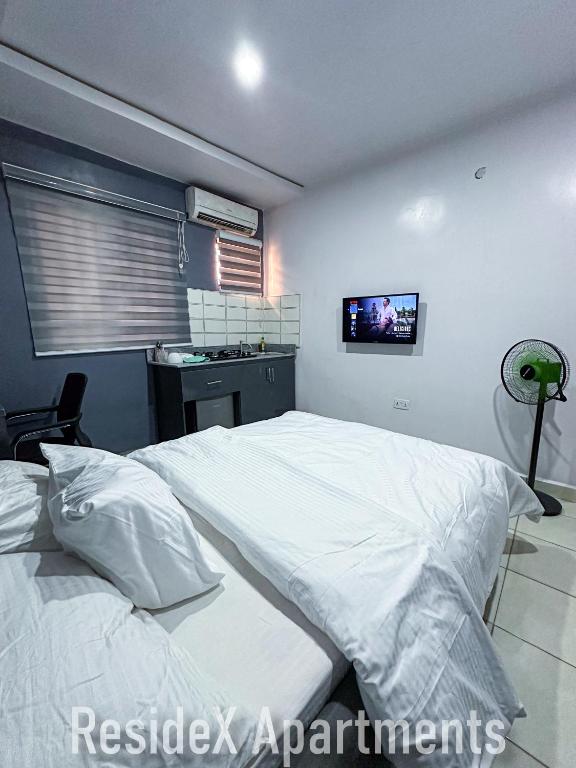 Postel nebo postele na pokoji v ubytování ResideX Apartment
