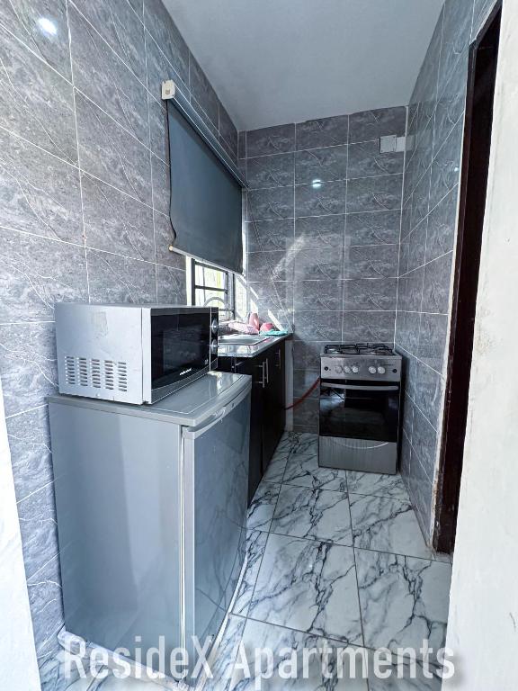 Kuchyň nebo kuchyňský kout v ubytování ResideX Apartment
