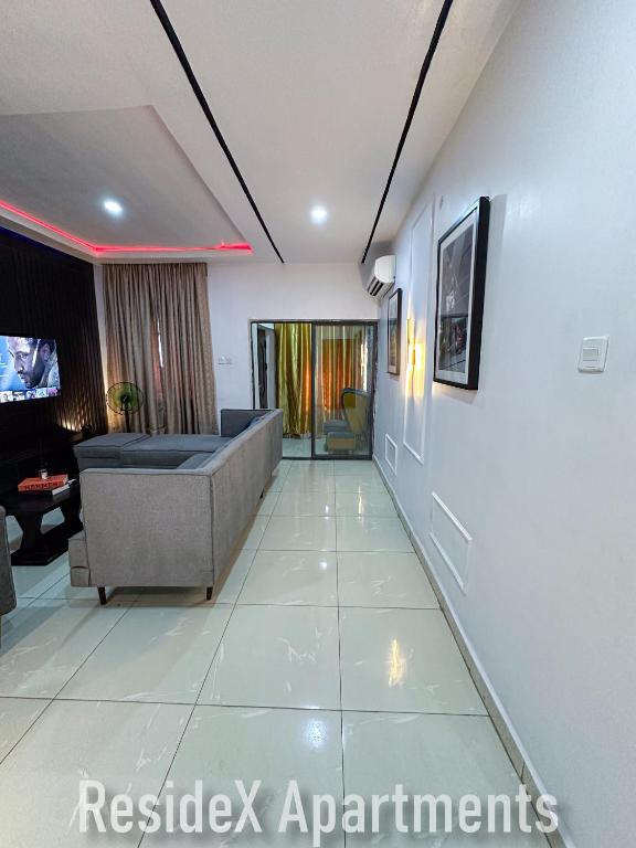 TV a/nebo společenská místnost v ubytování ResideX Apartment