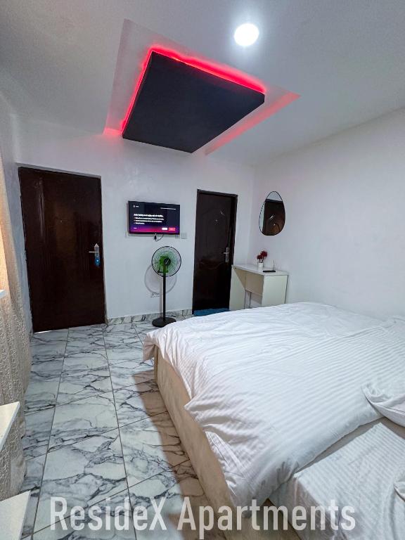 Postel nebo postele na pokoji v ubytování ResideX Apartment