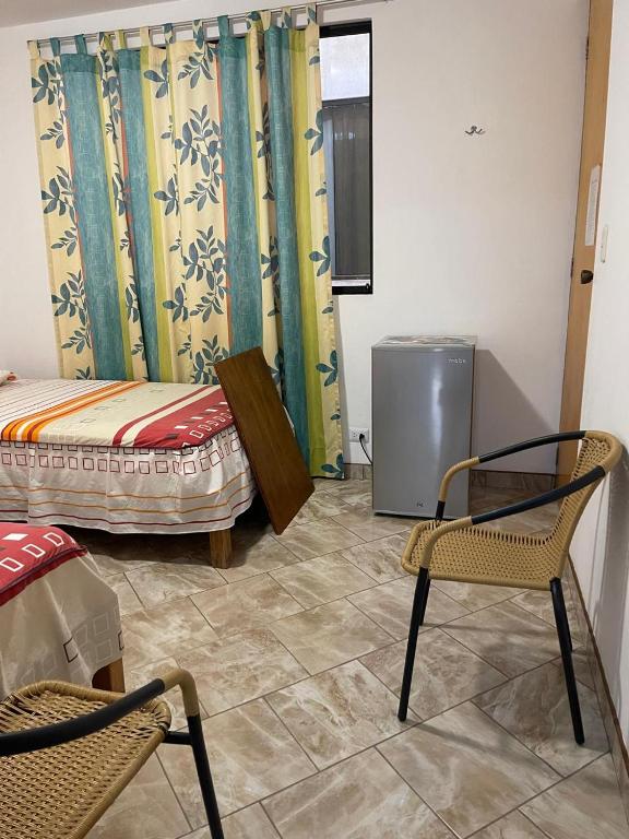 Postel nebo postele na pokoji v ubytování Hospedaje Puesta de Sol
