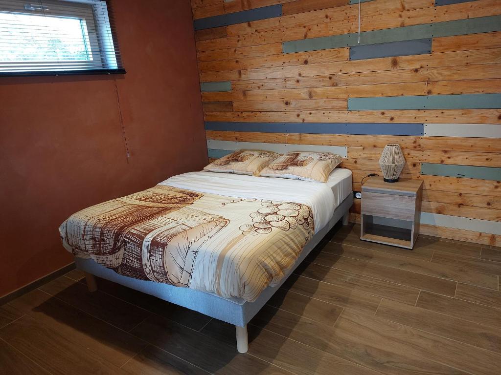 Postel nebo postele na pokoji v ubytování Winstub du vigneron