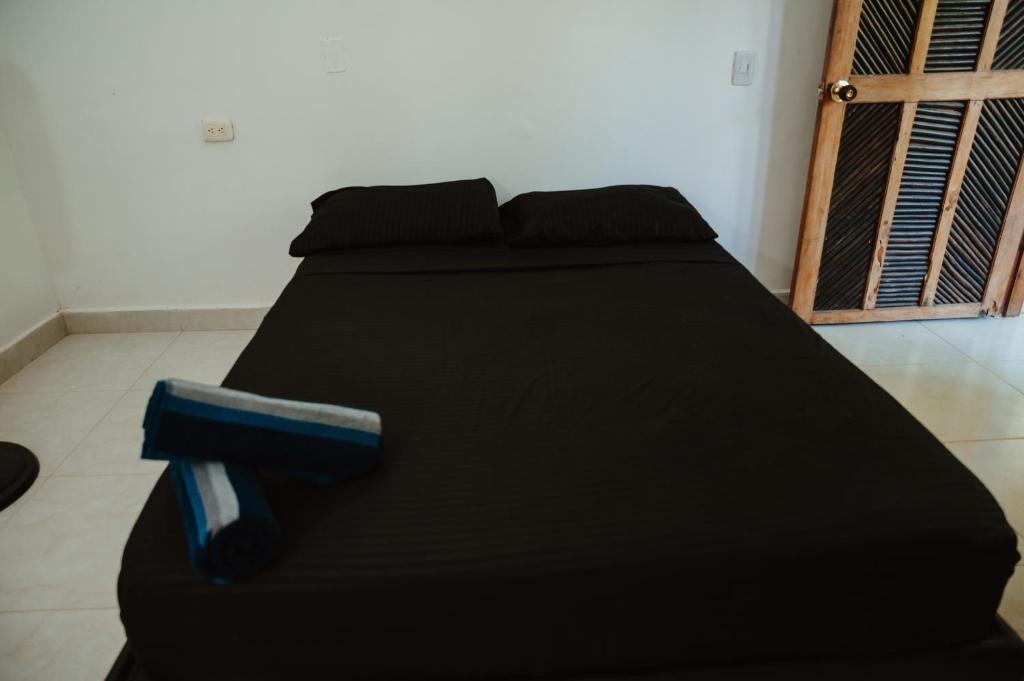 Postel nebo postele na pokoji v ubytování Hostal Casa Celeste