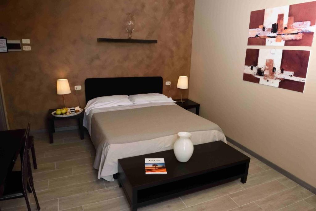 Postel nebo postele na pokoji v ubytování Hotel Residenza Alighieri