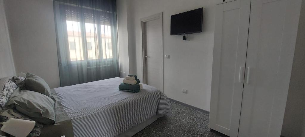 Postel nebo postele na pokoji v ubytování Emerald Room Pisa