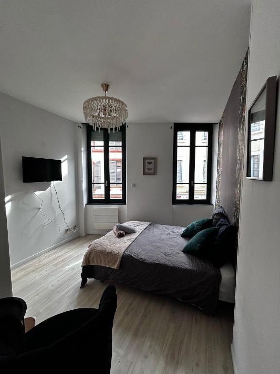 Ένα ή περισσότερα κρεβάτια σε δωμάτιο στο Magnifique chambre