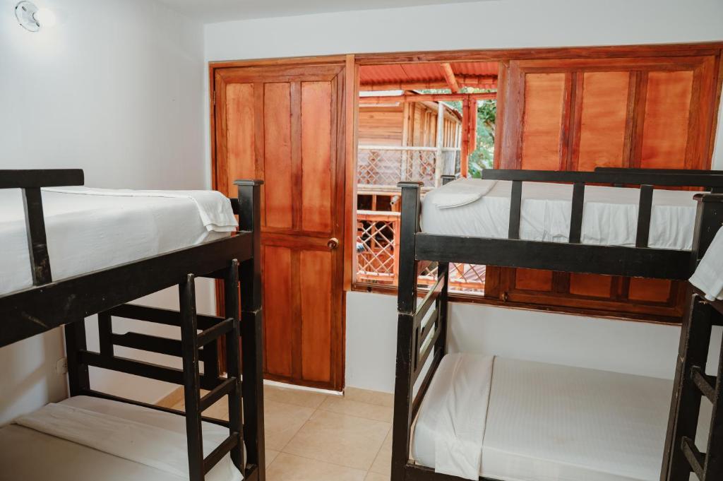 Postel nebo postele na pokoji v ubytování Hostal Casa Celeste