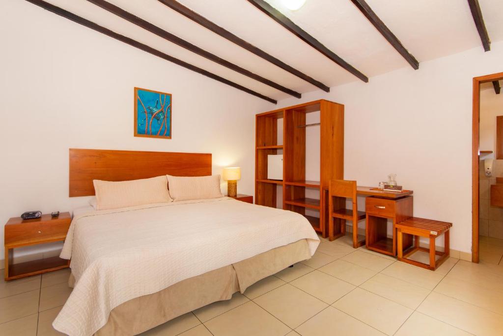 Postel nebo postele na pokoji v ubytování Hotel Fiesta