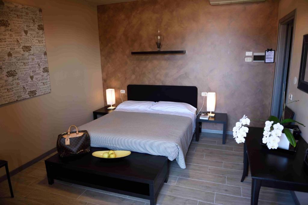 Postel nebo postele na pokoji v ubytování Hotel Residenza Alighieri