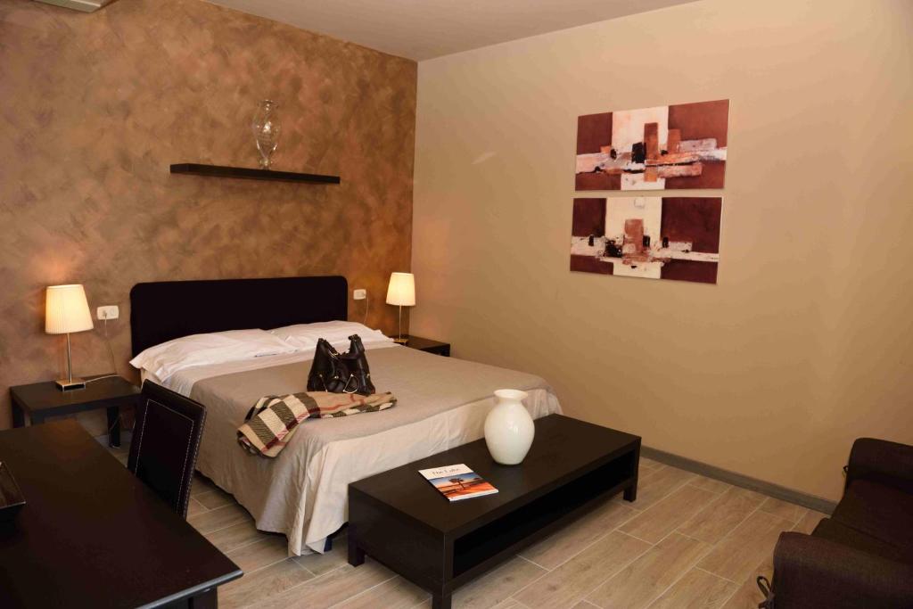 Postel nebo postele na pokoji v ubytování Hotel Residenza Alighieri