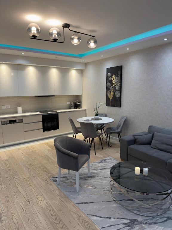 a living room with a couch and a table at Belgrade Waterfront Penthouse 17th last floor in Belgrade