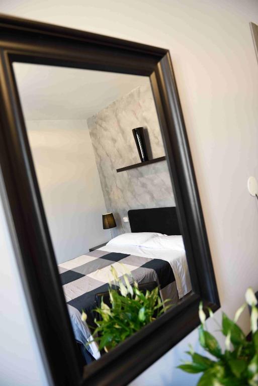Postel nebo postele na pokoji v ubytování Hotel Residenza Alighieri